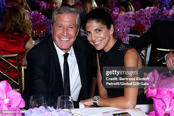 Jean-Claude Darmon and companion Hoda Roche attend 'Global Gift Gala' at Hotel George V on May 13, 2013 in Paris, France.