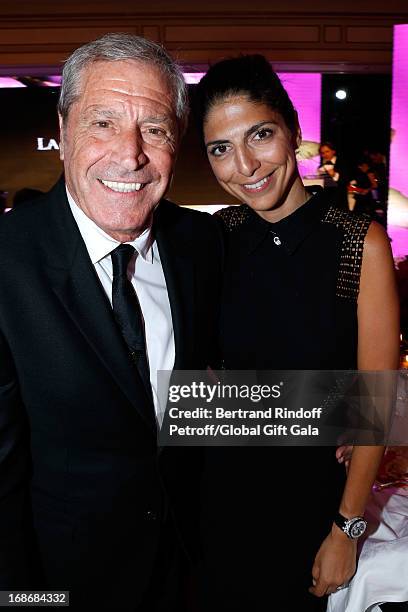 Jean-Claude Darmon and companion Hoda Roche attend 'Global Gift Gala' at Hotel George V on May 13, 2013 in Paris, France.