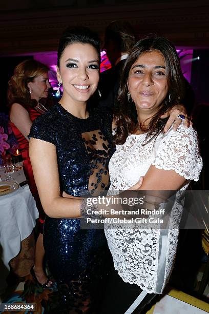 Eva Longoria and Stylist of Gerard Darel, Camille Naim attend 'Global Gift Gala' at Hotel George V on May 13, 2013 in Paris, France.