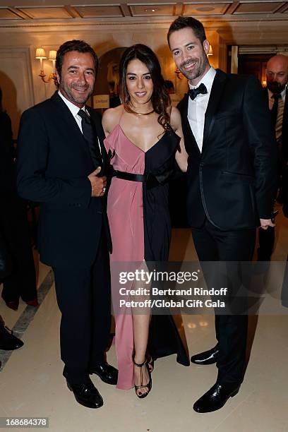 Bernard Montiel, Sofia Essaidi and guest attend 'Global Gift Gala' at Hotel George V on May 13, 2013 in Paris, France.