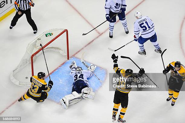 James Reimer of the Toronto Maple Leafs lays on the ice after letting in a goal in overtime against the Boston Bruins in Game Seven of the Eastern...