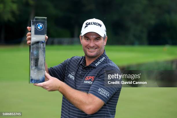 Ryan Fox of New Zealand holds the trophy after his one shot victory in the final round of the BMW PGA Championship at Wentworth Golf Club on...