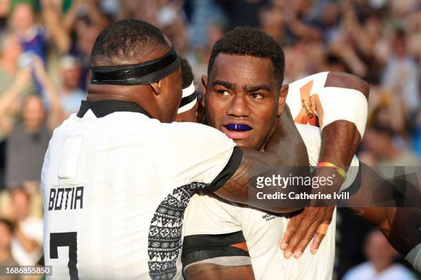 Josua Tuisova of Fiji celebrates with Levani Botia of Fiji ascoring his team's first try during the Rugby World Cup France 2023 match between...