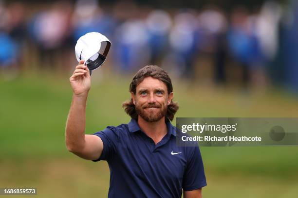 Tommy Fleetwood of England acknowledges the crowd on the 18th green during Day Four of the BMW PGA Championship at Wentworth Golf Club on September...