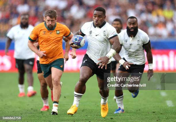 Josua Tuisova of Fiji breaks with the ball to score his team's first try during the Rugby World Cup France 2023 match between Australia and Fiji at...