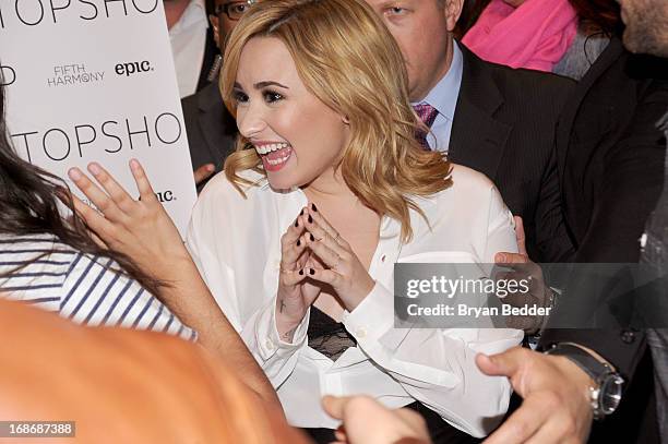 Demi Lovato attends X Factor's Topshop photo call with Demi Lovato & 5th Harmony on May 13, 2013 in New York City.