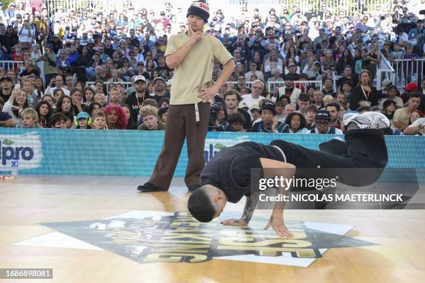 Chinese Taipei's B-Boy Quake aka Sun Chen and Chilean B-Boy Matita aka Matias Ignacio Martinez Hidalgo perform at the final stages of the Breaking...