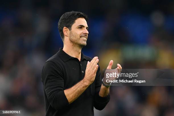 Mikel Arteta, Manager of Arsenal, applauds the fans after the team's victory in the Premier League match between Everton FC and Arsenal FC at...
