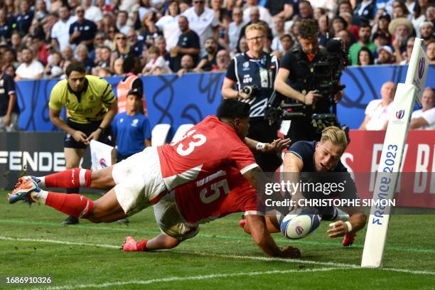 Scotland's left wing Duhan van der Merwe dives and fails to score a try during the France 2023 Rugby World Cup Pool B match between Scotland and...