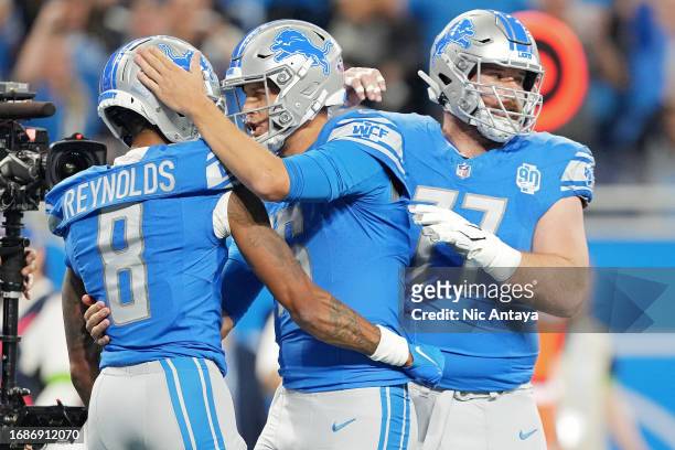 Josh Reynolds of the Detroit Lions celebrates a touchdown with Jared Goff during the first quarter in the game against the Seattle Seahawks at Ford...