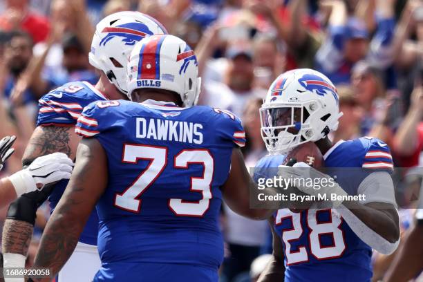 Latavius Murray of the Buffalo Bills celebrates with teammates after scoring a touchdown during the first quarter against the Las Vegas Raiders at...