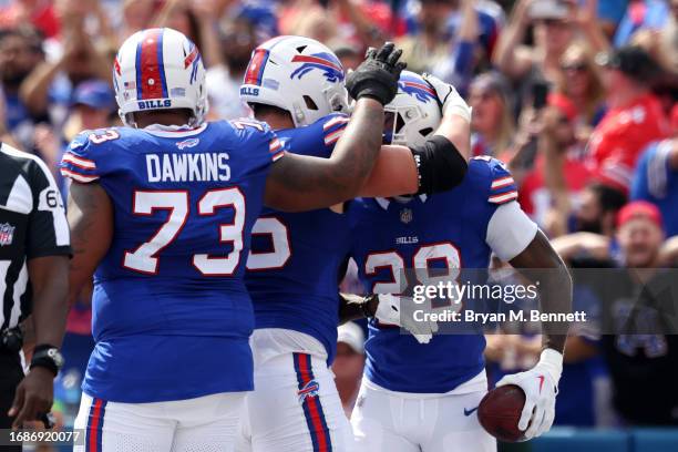 Latavius Murray of the Buffalo Bills celebrates with teammates after scoring a touchdown during the first quarter against the Las Vegas Raiders at...