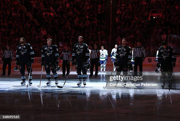 Brent Burns, Matt Irwin, Joe Thornton, T.J. Galiardi and Dan Boyle of the San Jose Sharks stand attended before Game Four of the Western Conference...