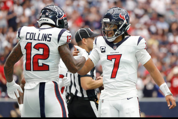Nico Collins of the Houston Texans celebrates a touchdown with C.J. Stroud during the first quarter against the Indianapolis Colts at NRG Stadium in...