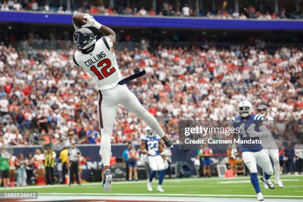 Nico Collins of the Houston Texans catches a touchdown pass during the first quarter against the Indianapolis Colts at NRG Stadium on September 17,...