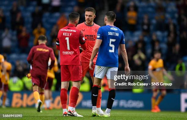 Motherwell's Liam Kelly speaks to Rangers' John Souttar and Jack Butland at full time during a cinch Premiership match between Rangers and Motherwell...