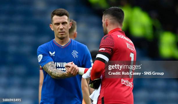 Rangers' Ryan Jack shakes hands with Motherwell's Liam Kelly during a cinch Premiership match between Rangers and Motherwell at Ibrox Stadium, on...
