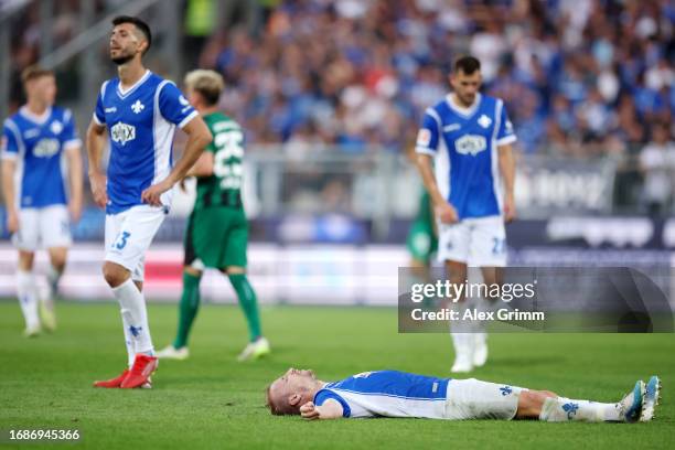 Fabian Holland of SV Darmstadt 98 looks dejected after the draw in the Bundesliga match between SV Darmstadt 98 and Borussia Mönchengladbach at...