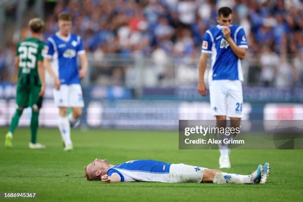 Fabian Holland of SV Darmstadt 98 looks dejected after the draw in the Bundesliga match between SV Darmstadt 98 and Borussia Mönchengladbach at...