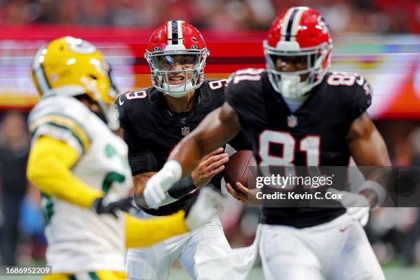 Desmond Ridder of the Atlanta Falcons runs the ball during the first quarter in the game against the Green Bay Packers at Mercedes-Benz Stadium on...