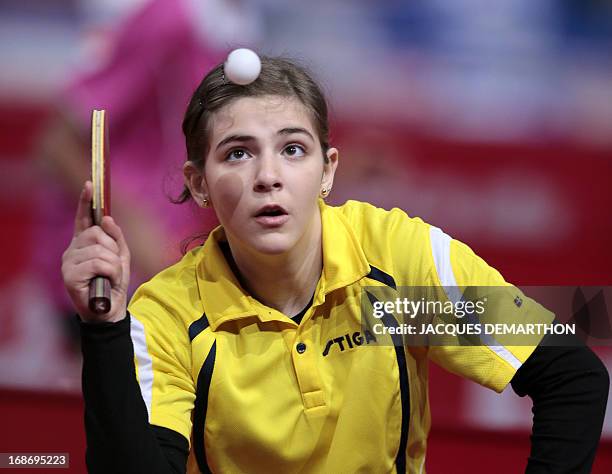 Syria's Tasnim Nabhan serves to Taipei's Liu Hsing-Yin during a Women's Singles qualifications groups match of the World Table Tennis Championships...