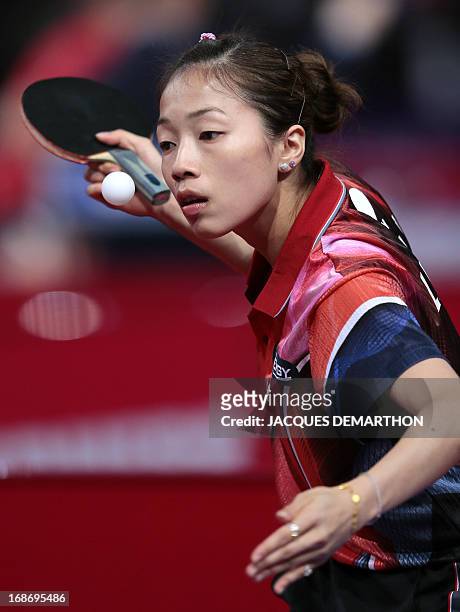 Taipei's player Liu Hsing-Yin serves to Tasnim Nabhan of Syria on May 14, 2013 in Paris, during the Women's Singles qualifications groups of the...
