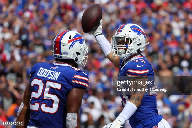 Tyrel Dodson of the Buffalo Bills celebrates with Terrel Bernard of the Buffalo Bills after Bernard's interception during the first quarter against...