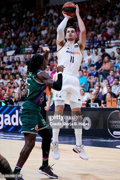 Mario Hezonja of Real Madrid and Kendrick Perry of Unicaja Malaga during Finals of Supercopa of Liga Endesa match between Real Madrid and Unicaja...