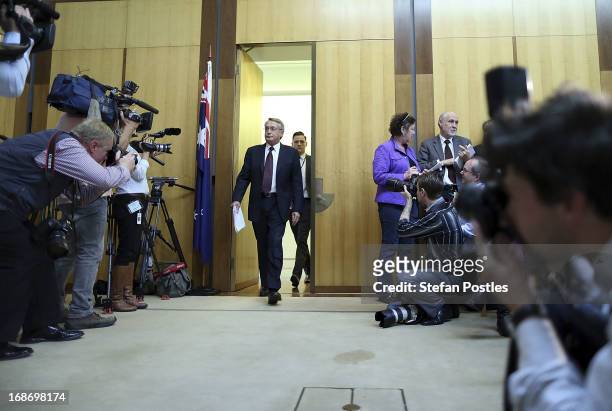 Treasurer Wayne Swan arrives at a press conference on May 14, 2013 in Canberra, Australia. Treasurer Wayne Swan will tonight present the federal...
