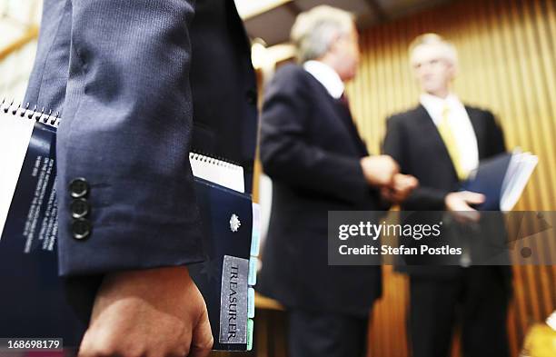 Treasurer Wayne Swan talks over the details of the budget with members of the media held in 'Budget lock up' on May 14, 2013 in Canberra, Australia....