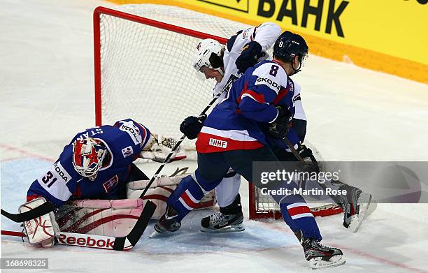 Rastislav Stana , goaltender of Slovakia makes a save on TJ Oshie of USA during the IIHF World Championship group H match between Slovakia and USA at...