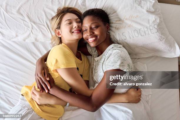 romantic lesbian interracial couple - lgbt, diversity and inclusion concept - falling in love stock pictures, royalty-free photos & images