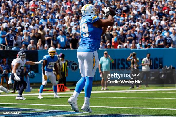 Trey Pipkins III of the Los Angeles Chargers catches a two point conversion during the second quarter against the Tennessee Titans at Nissan Stadium...