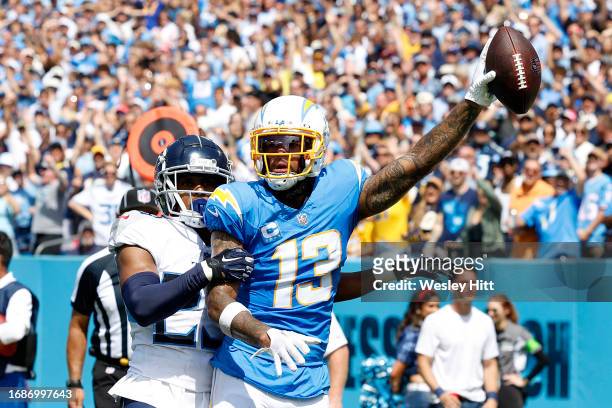 Keenan Allen of the Los Angeles Chargers celebrates after catching a touchdown over Tre Avery of the Tennessee Titans during the second quarter at...
