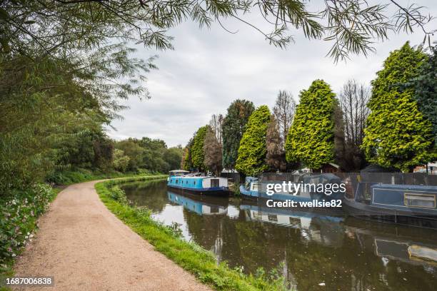 narrow boats next to crooke marina - towpath stock pictures, royalty-free photos & images