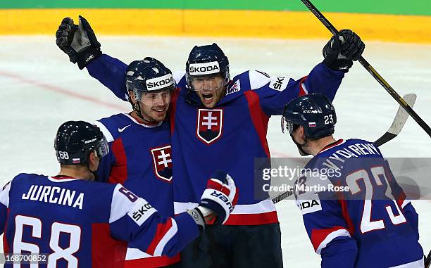 Tomas Zaborsky and Roman Kukumberg of Slovakia celebrate their team's 3rd goal during the IIHF World Championship group H match between Slovakia and...