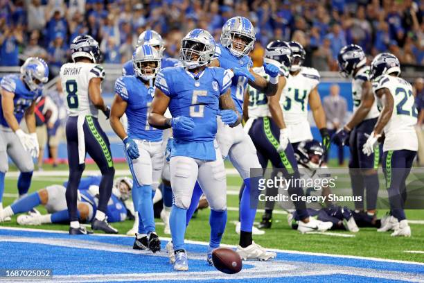 David Montgomery of the Detroit Lions celebrates a touchdown during the third quarter in the game against the Seattle Seahawks at Ford Field on...