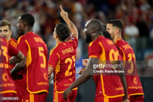 Paulo Dybala with his teammates of AS Roma celebrates after scoring the opening goal from penalty spot during the Serie A TIM match between AS Roma...