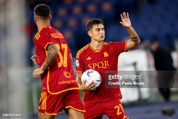 Paulo Dybala with his teammates of AS Roma celebrates after scoring the opening goal from penalty spot during the Serie A TIM match between AS Roma...