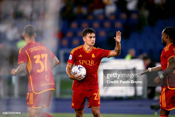 Paulo Dybala with his teammates of AS Roma celebrates after scoring the opening goal from penalty spot during the Serie A TIM match between AS Roma...