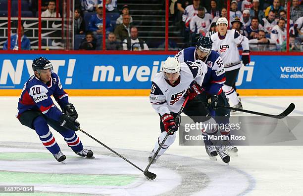 Marko Dano of Slovakia and Craig Smith of USA battle for the puck during the IIHF World Championship group H match between Slovakia and USA at...