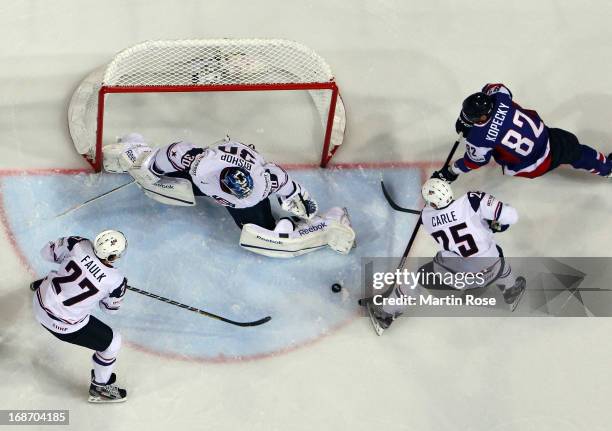 Tomas Kopecky of Slovakia and Matt Carle of USA battle for the puck during the IIHF World Championship group H match between Slovakia and USA at...