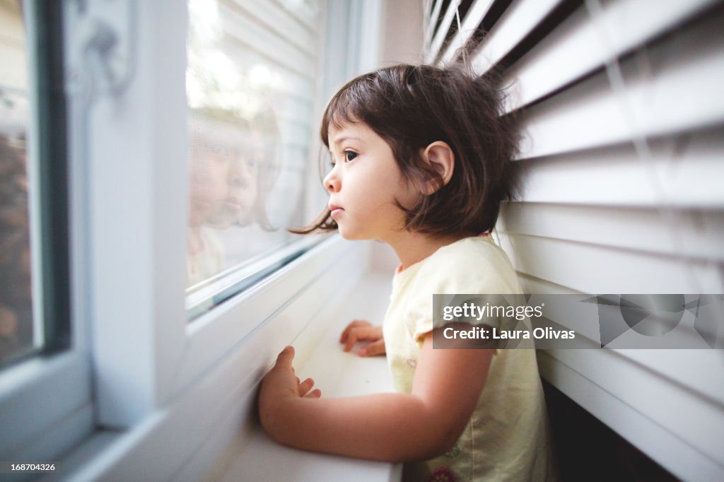 Toddler Girl By Window