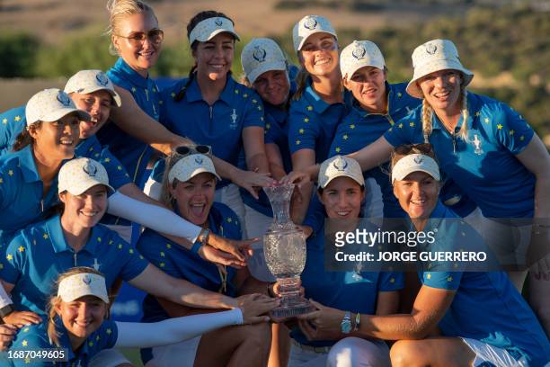 Team Europe pose with their Solheim Cup trophy after beating US team, on the last day of the 2023 Solheim Cup biennial team golf competition at Finca...