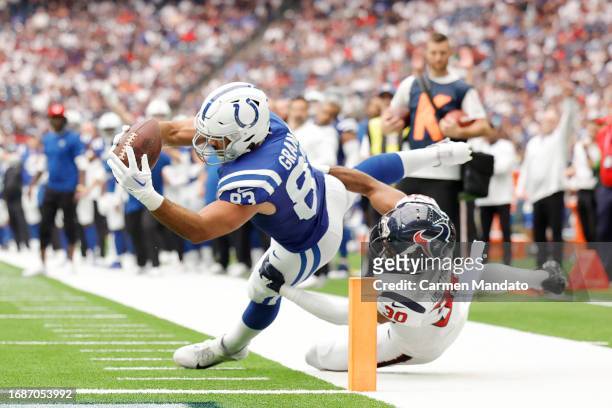 Kylen Granson of the Indianapolis Colts scores a touchdown against the Houston Texans during the second quarter at NRG Stadium on September 17, 2023...