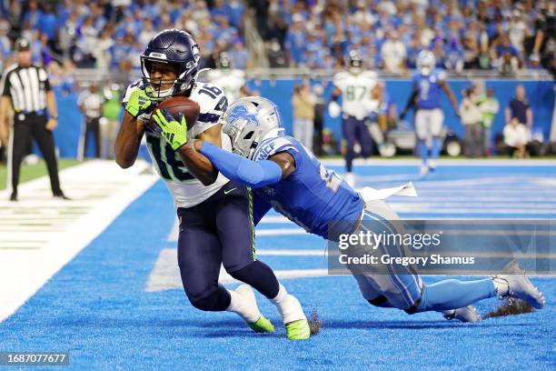 Tyler Lockett of the Seattle Seahawks catches a touchdown pass during the fourth quarter in the game against the Detroit Lions at Ford Field on...