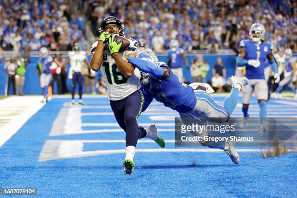 Tyler Lockett of the Seattle Seahawks catches a touchdown pass during the fourth quarter in the game against the Detroit Lions at Ford Field on...