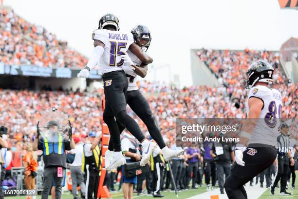 Nelson Agholor of the Baltimore Ravens and Zay Flowers celebrates a touchdown during the fourth quarter in the game against the Cincinnati Bengals at...