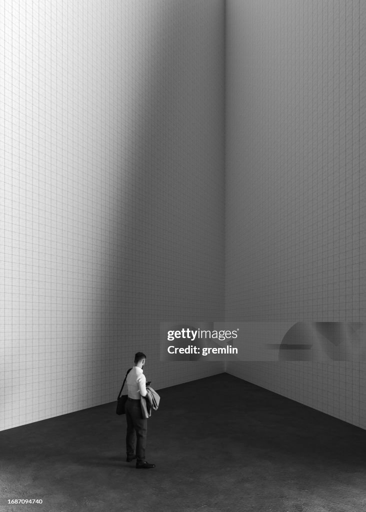 Businessman standing in the corner