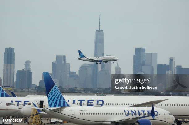 United Airlines plane lands at Newark Liberty International Airport in front of the New York skyline on September 17, 2023 in Newark, New Jersey.